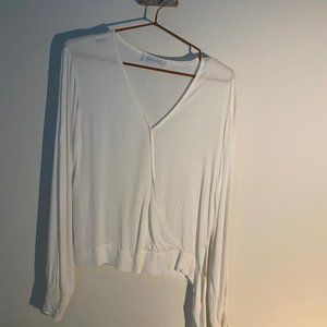 Woman's White Blouse Tie Knot at the side.